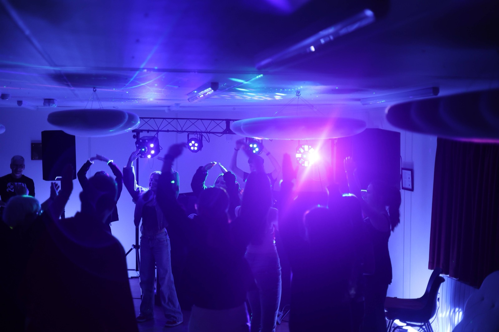 Professional event DJ Charlie mixing music live behind the decks